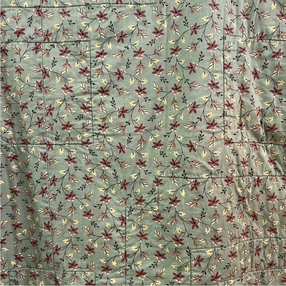 Hand crafted yellow square and floral quilt